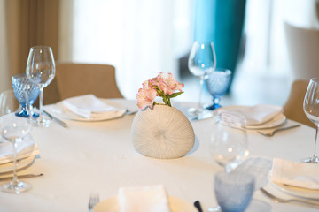 modern vase with flowers at restaurant