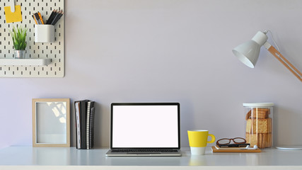 Workspace blank screen computer  and office equipment is on the table. Modern working desk concept.