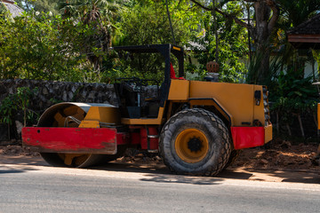 Road rollers working on the new roads construction site. Heavy duty machinery working on highway. Construction equipment. Compaction of the road.