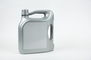 Gray plastic can with engine oil. five liters bottle of car oil on white background
