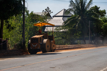 Road rollers working on the new roads construction site. Heavy duty machinery working on highway....
