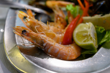 Cooked langoustine shrimps served with lemon