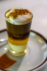Special coffee of Canary islands, sweet barraquito coffee with layers and alcohol served in glass