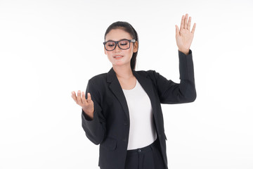 An attractive woman wearing business attire waving her hands in the air navigating on an invisible screen isolated on white. Suitable for image cut out and manipulation works for technology, business.