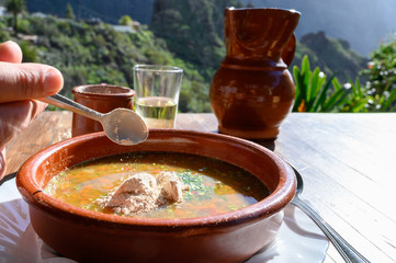Homemade vegetables soup served with Canarian gofio flour based on local recipe of Masca village, Tenerife, Spain © barmalini
