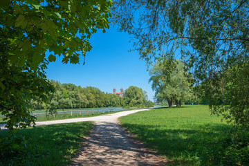 idyllic walkway at riverside of Isar river in munich, recreational area in the city
