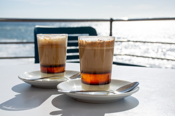 Special coffee of Canary islands, sweet barraquito coffee with layers and alcohol served in glass