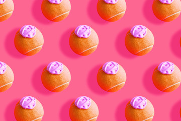 Orange tennis ball pattern with pink paint - ice cream imitation - on coral abstract background