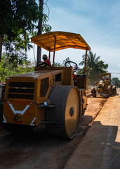 Road rollers working on the new roads construction site. Heavy duty machinery working on highway. Construction equipment. Compaction of the road.