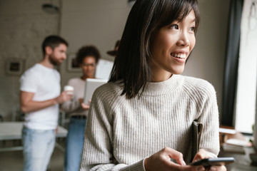 Image of multiethnic young business people working together at office