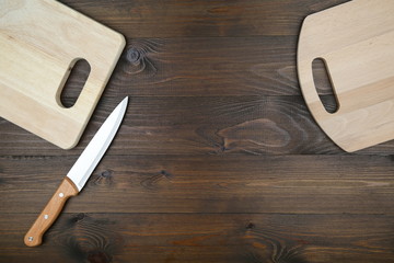 kitchen knife with a wooden handle and cutting boards flat lay with copy space