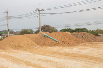 The Construction clay for road construction in working area