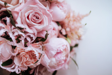 Fototapeta na wymiar Fluffy pink peonies flowers background copy space