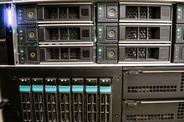 Front panel of multifunctional computer equipment. The database server is in the rack of the data center. Modern computer equipment is installed in the server room