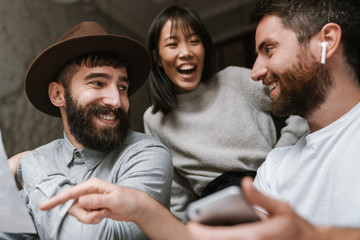 Image of multiethnic young business people working together at office