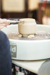 potter girl in the workshop with pottery