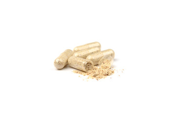 Herbal capsules isolated on white background.