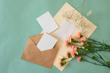 blank card in an envelope with flowers