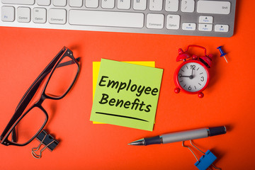 EMPLOYEE BENEFITS - notice on workplace background. Hiring concept