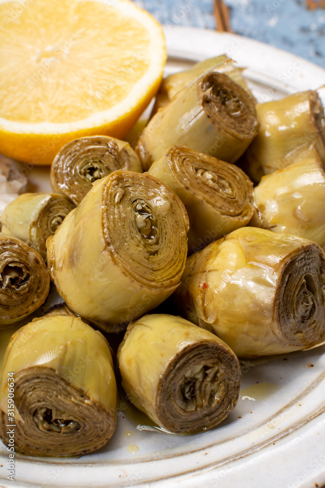 Wall mural Marinated artichokes with garlic, lemon and olive oil