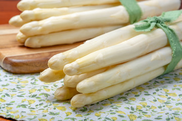 Bunch of fresh uncooked white asparagus, new harvest