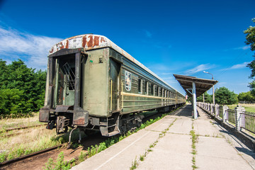 Fototapeta na wymiar Abandoned retro wagon in Ukraine. Sunny summer day