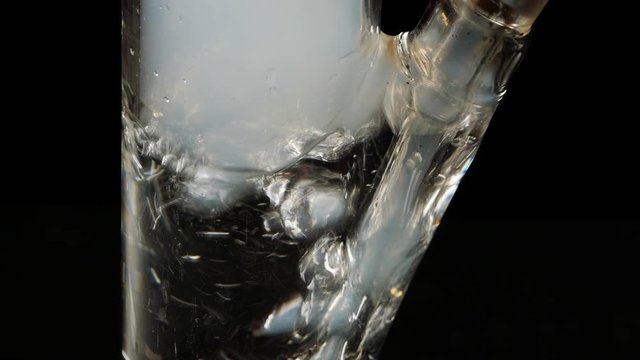 Glass Bong on black background.Smoking closeup.Marijuana,tobacco and Shisha.