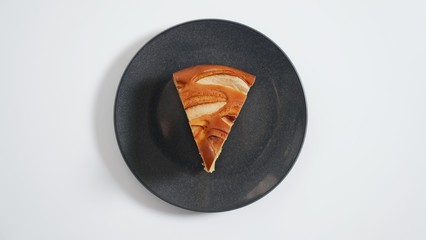 Apple pie, apple casserole on a black plate 