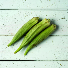 raw okra pods on a table