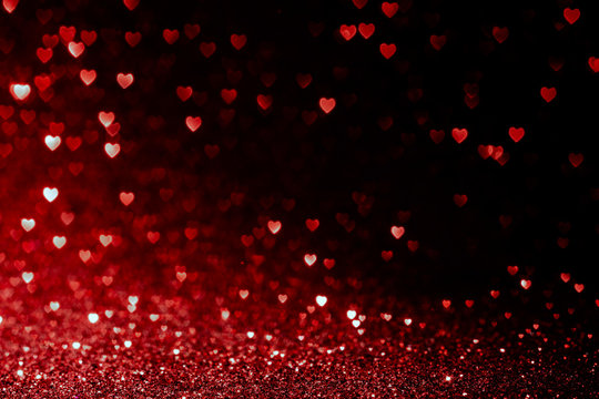 valentines day background with red hearts glitter bokeh on black, card for Valentine's day, christmas and wedding celebration, Love bokeh shiny confetti textured template