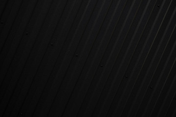 Obraz premium Black Corrugated metal sheet texture surface of the wall. Galvanize steel background.
