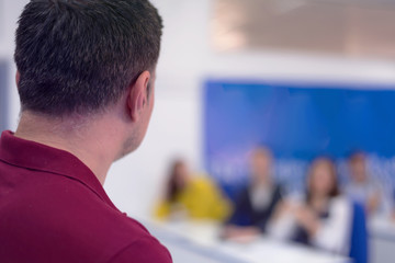 Male Professor Holding Lecture to Multi Ethnic Group of Students. Smart Young People Studying at the University.