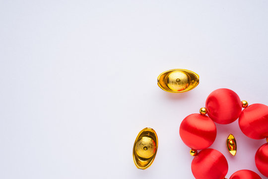 Chinese New Year decorations with white background with assorted festival decorations. Chinese characters means abundant of wealth, prosperity and luck. Flat lay or top view.