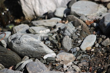 STONES ON THE RIVER BANK