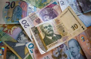 Bulgarian lev between other currency in a colorful mix