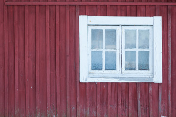 Old shed frozen window and wall at winter