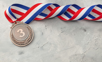 Bronze medal. Third place award with ribbon