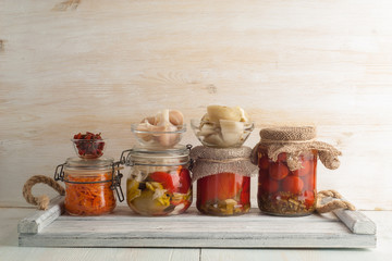 Homemade canned pickled and fermented vegetables for long-term storage.