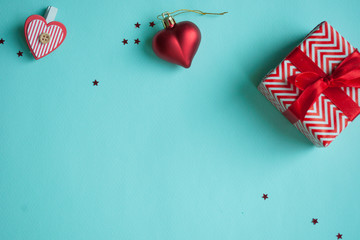 Valentines Day background. Red heart, gift box, ribbon shaped as heart