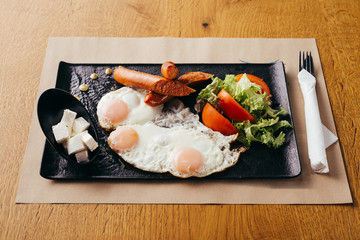 toast eggs and sausages served on plate