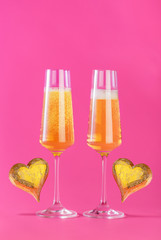 Valentines day background with champagne glasses and gold heart