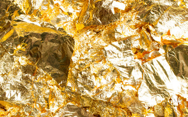 Golden foil pieces as shiny decoration texture element