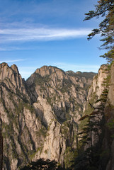 Huangshan Mountain in Anhui Province, China. Between Sanxi Bridge and Fairy Walking Bridge on Huangshan looking through to the West Sea or Xi Hai. Scenic view of peaks on Huangshan Mountain, China.