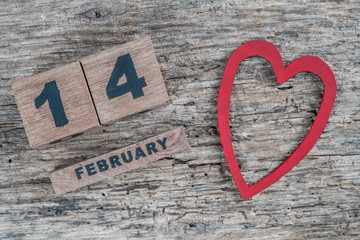 valentines day greeting template on wooden background with cube calendar