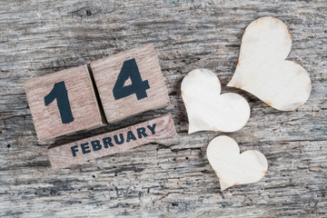 valentines day greeting template on wooden background with cube calendar