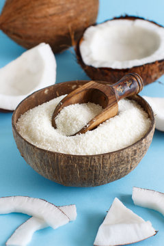 Coconut Flour In A Bowl With Coconut Pieces