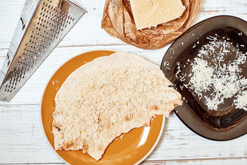 Round pita bread and cheese. Cooking snacks.