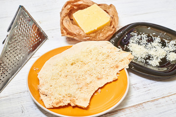 Round pita bread and cheese. Cooking snacks.