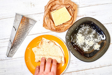 Round pita bread and cheese. Cooking snacks.