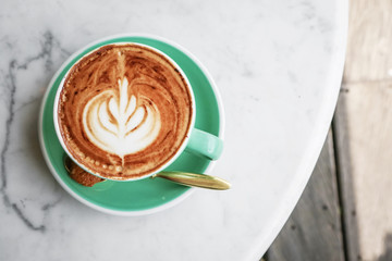 A cup of coffee with latte art on top